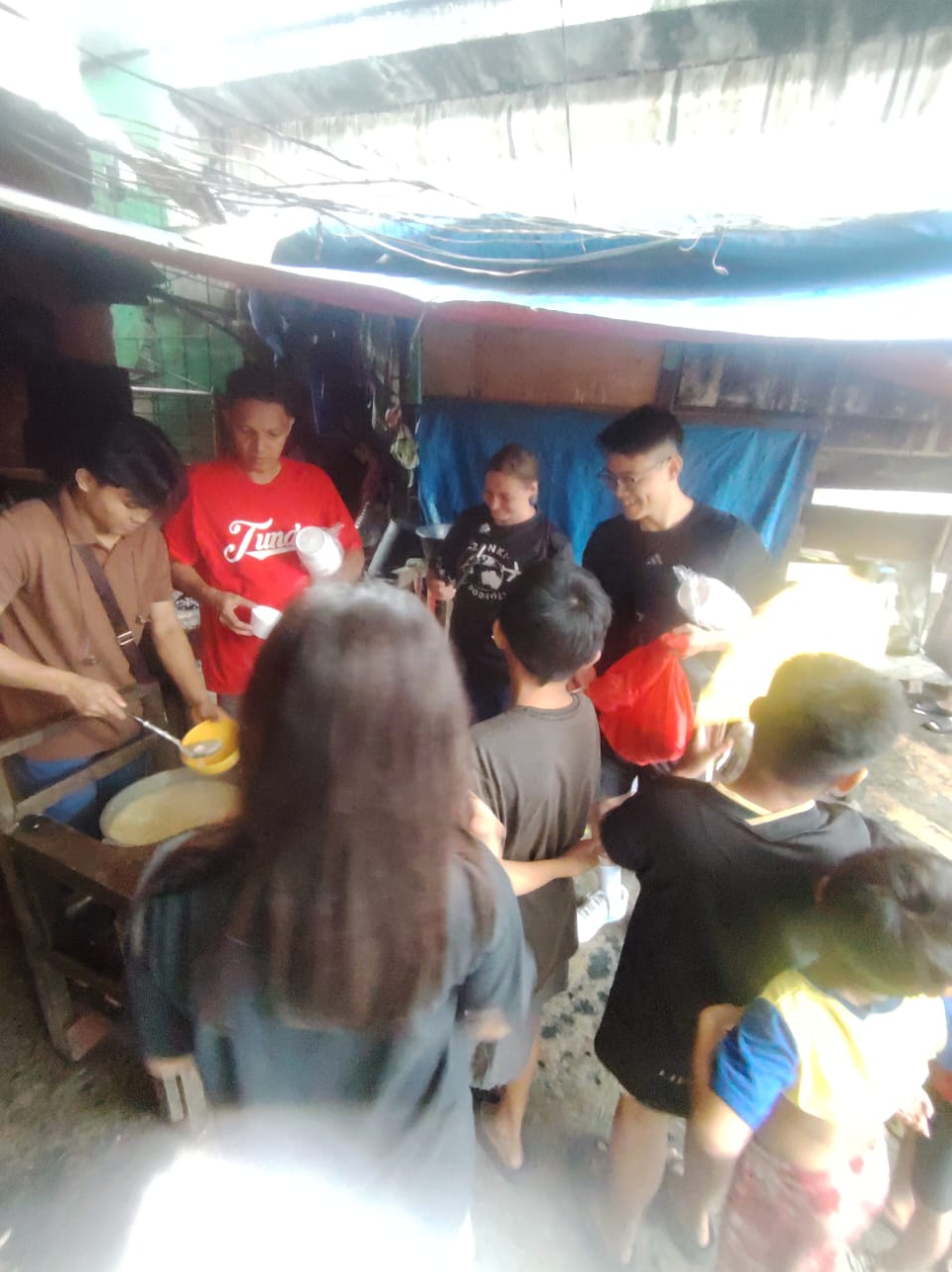 International guests exploring Tondo with Walk In Tondo local guide Ryan